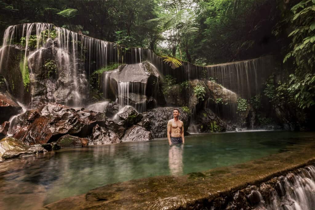 Jared Dillingham swimming at Goa Raja natural pool on Bali