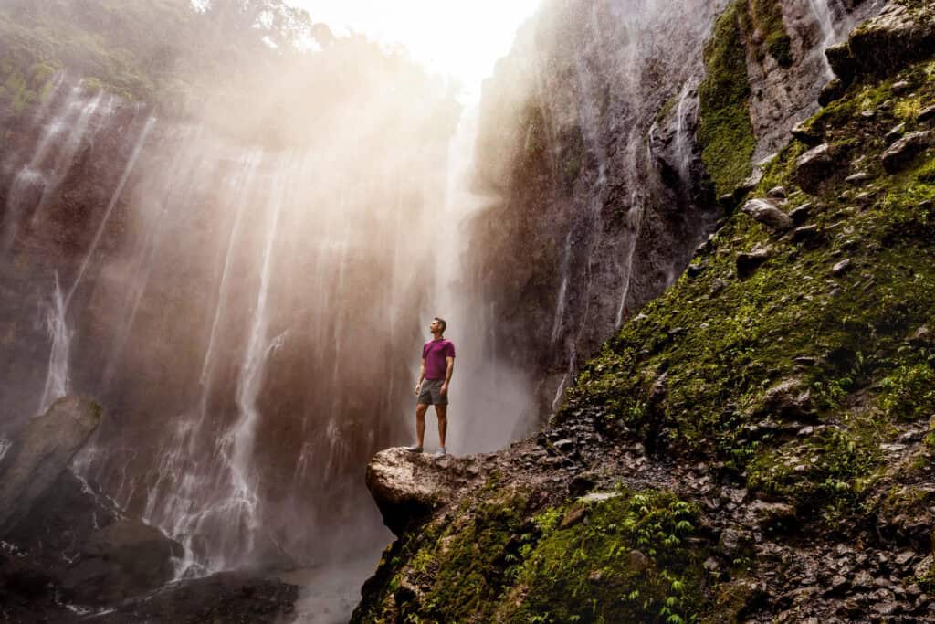 Jared Dillingham at the base of the Tumpak Sewu waterfalls in Indonesia