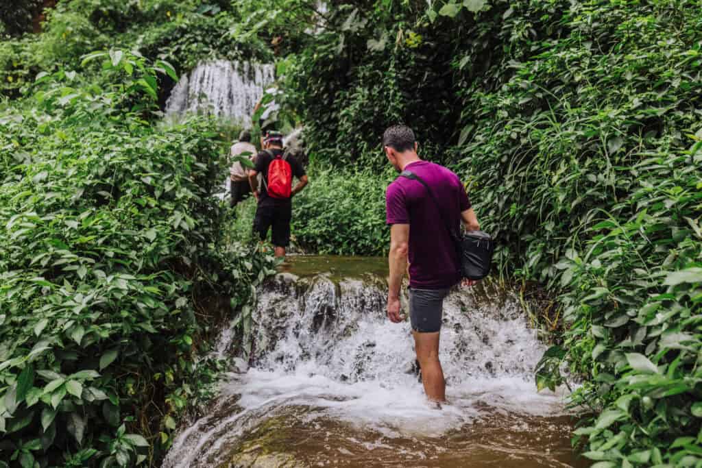 Hiking through the water in Indonesia