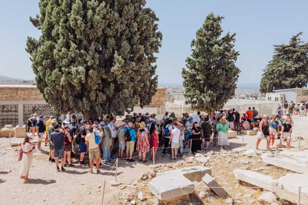 Taking cover in the shade at the Acropolis in June