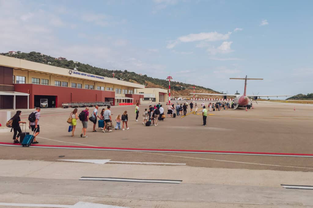 Walking on the tarmac at an airport in Greece