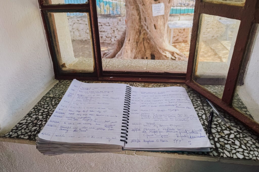 The guest book inside the church on the rocks in Skopelos