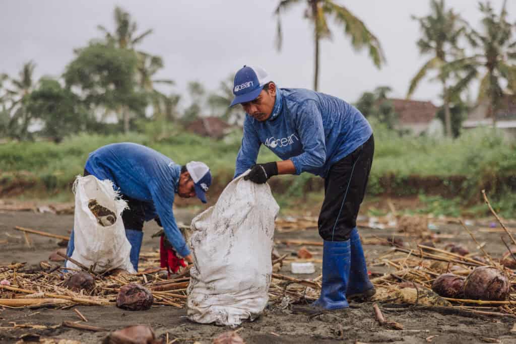 A 4ocean team cleaning a Bali beach