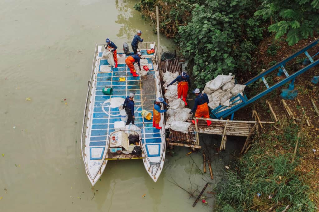 A 4ocean river cleanup boat on a Bali river