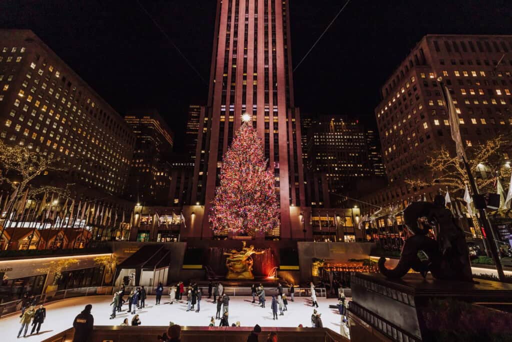 Skating on the rink at Rockefeller Plaza at night in December